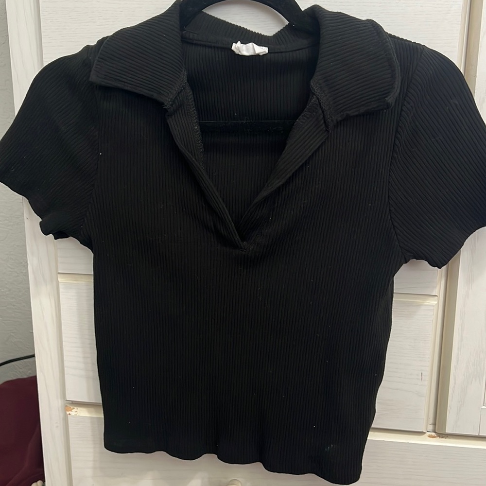 Black ribbed top with collar.